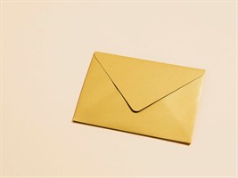 An envelope on a beige surface
